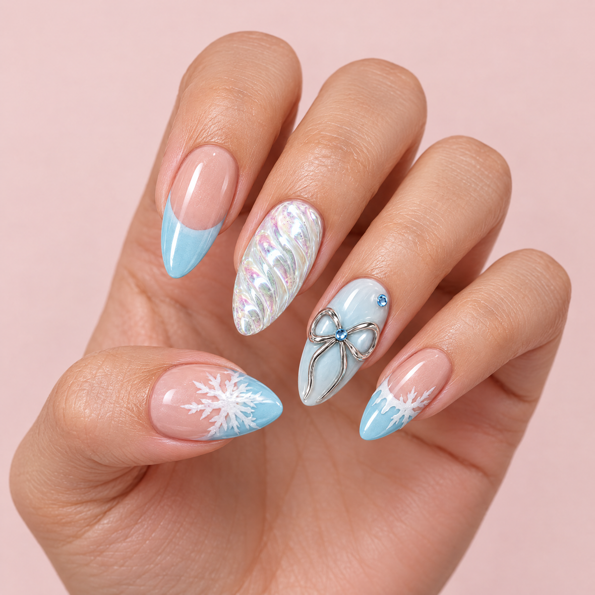 Snowflake & Silver Bow French Press On Nails worn on a hand