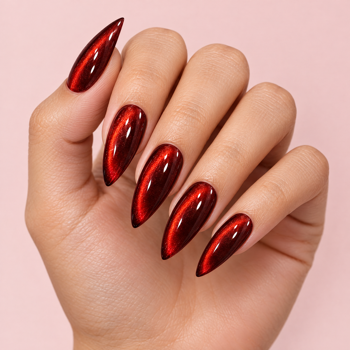 Burgundy Red Cat Eye Press On Nails worn on a hand