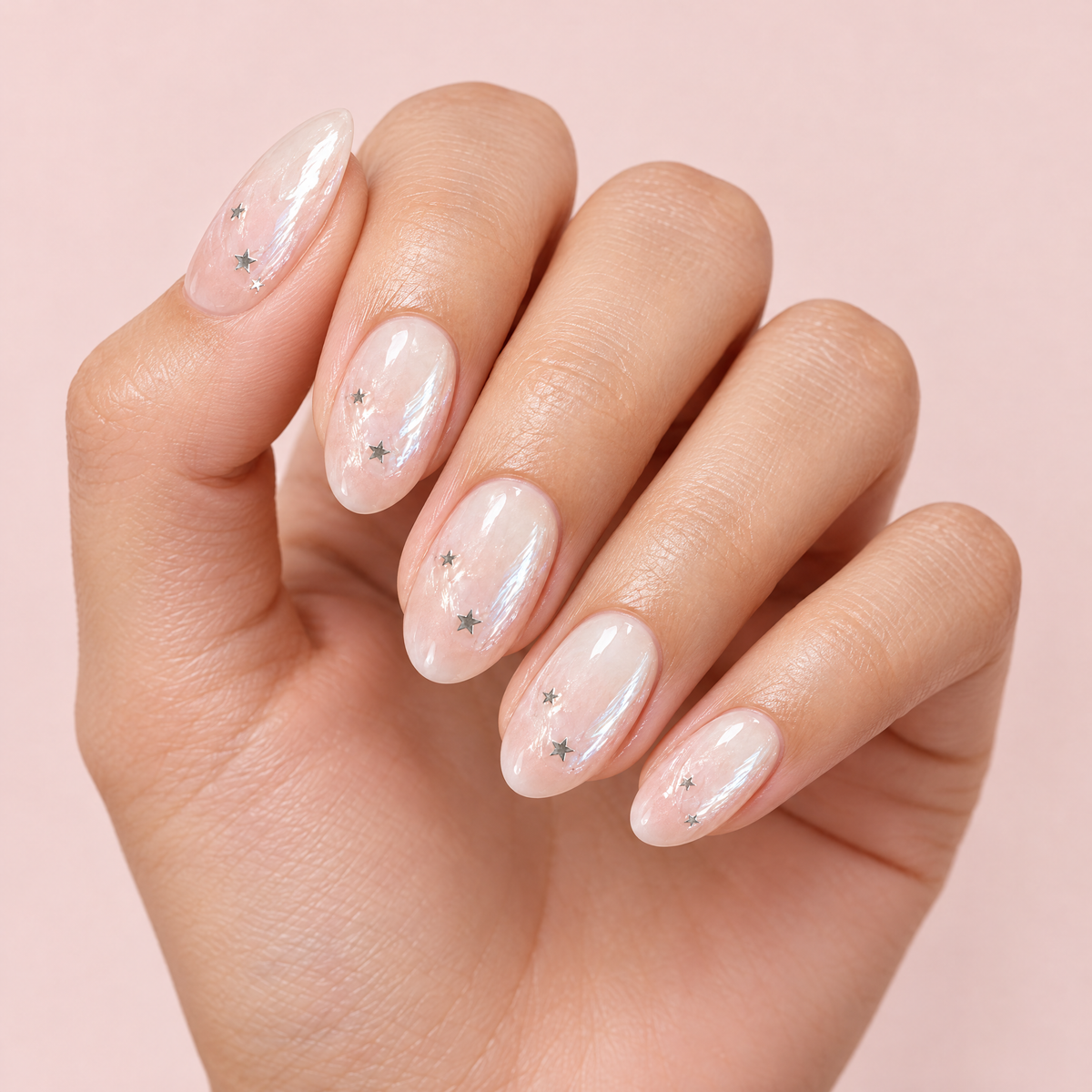 Milky Ombre Silver Star Press On Nails worn on a hand